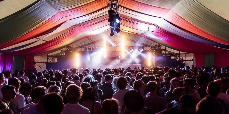 The Garden Party, Leeds. Kwikform DJ and PA Riser in Tent during event with audience and lighting